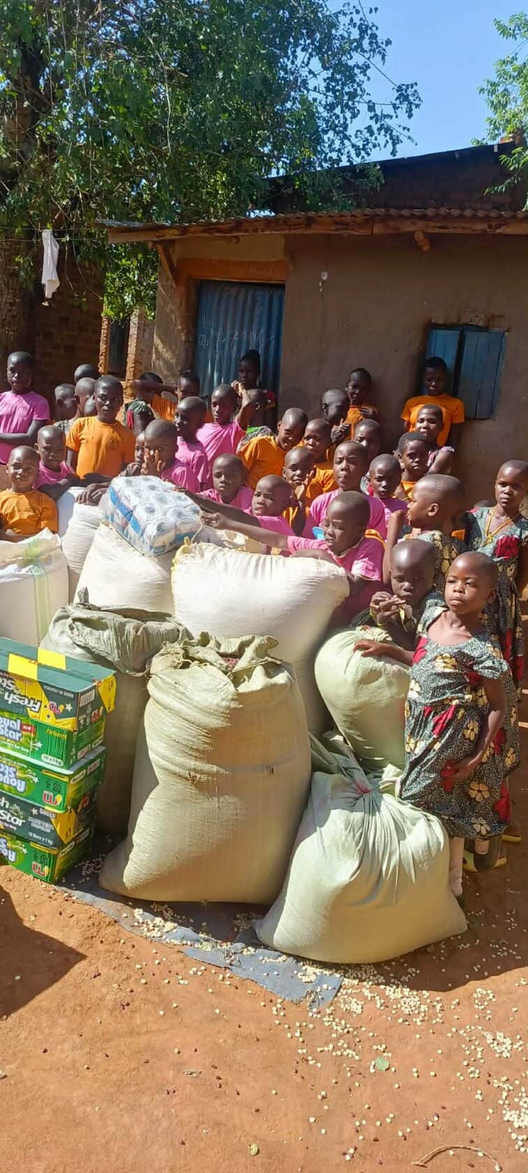 Uganda, children receiving food
