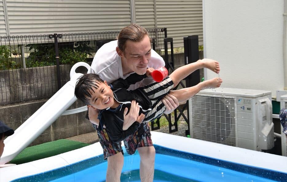 Teacher Playing With Child at Hilltop International School